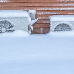 snow buried heat pump fans